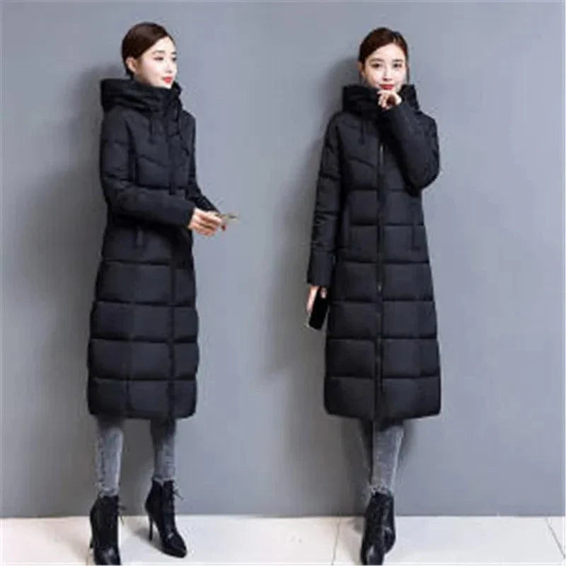 Winter hooded long slim-fit padded jacket for women with over-the-knee length.