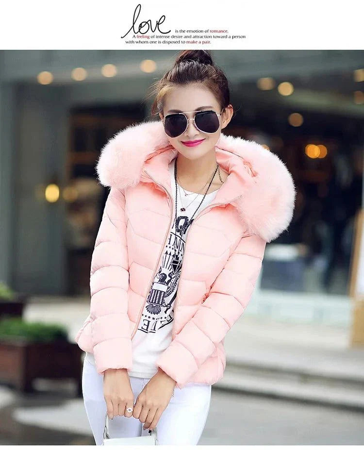 Women's pink parka with artificial raccoon fur collar, stylish winter jacket for 2024.