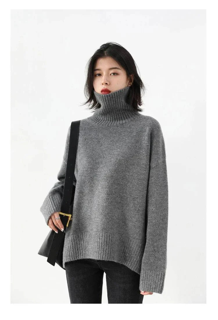 Women's grey loose turtleneck pullover sweater, cozy knitwear, autumn winter fashion.