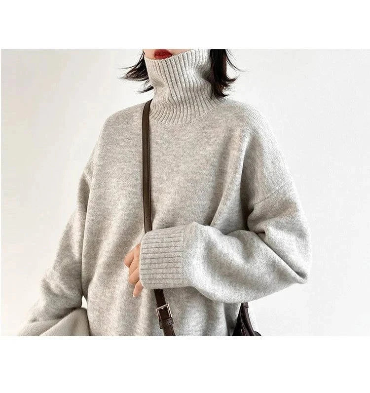 Women's sweater with loose turtleneck pullover knitwear, solid pattern, and full-length sleeves, perfect for autumn and winter wear.