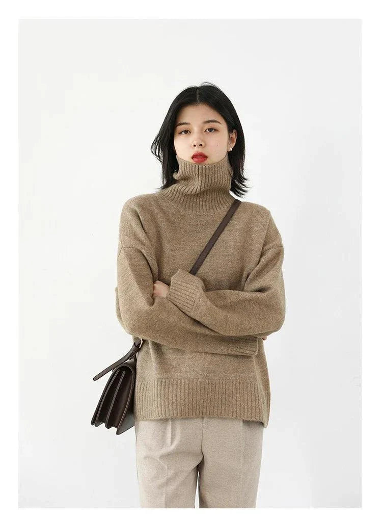 Women's loose turtleneck pullover knitwear sweater in solid color.