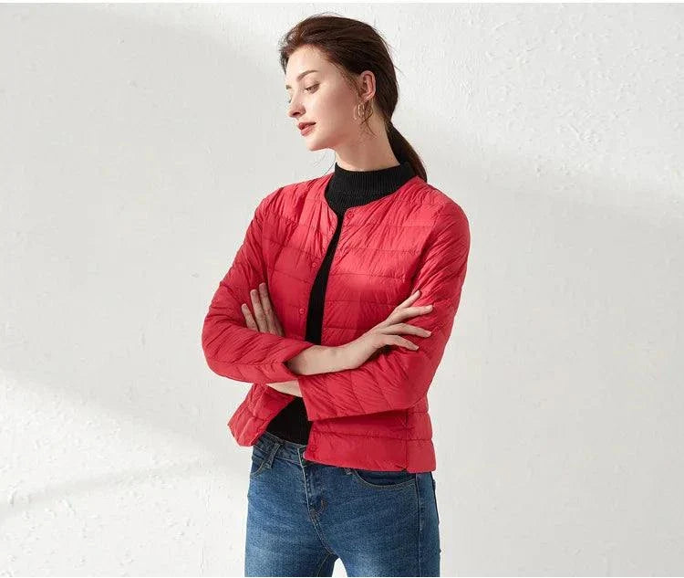 Ultralight warm women's puffer jacket, red, collarless, O-neck design, worn by a woman.