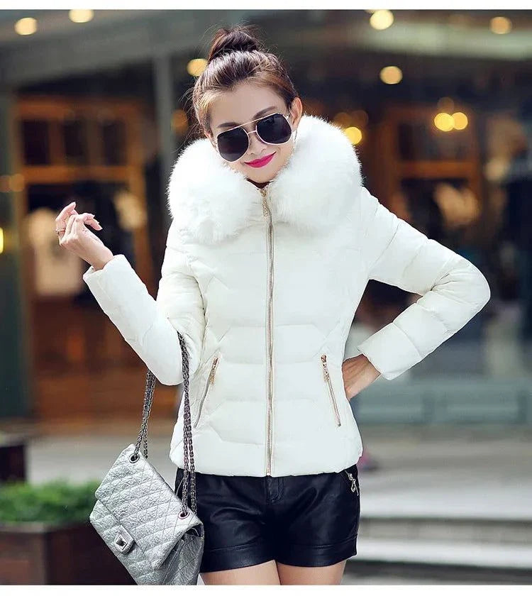 Women's winter jacket with artificial raccoon fur collar, stylish white parka for 2024.