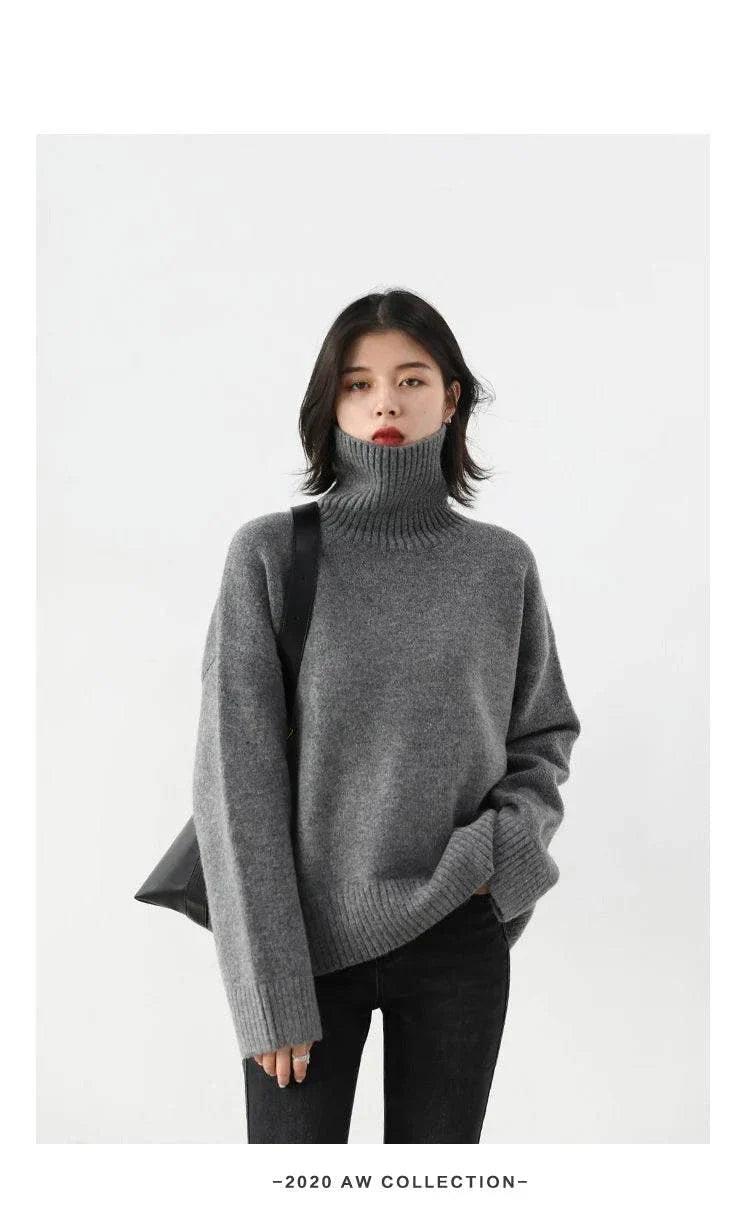 Women's gray loose turtleneck pullover sweater, cozy knitwear for autumn and winter.