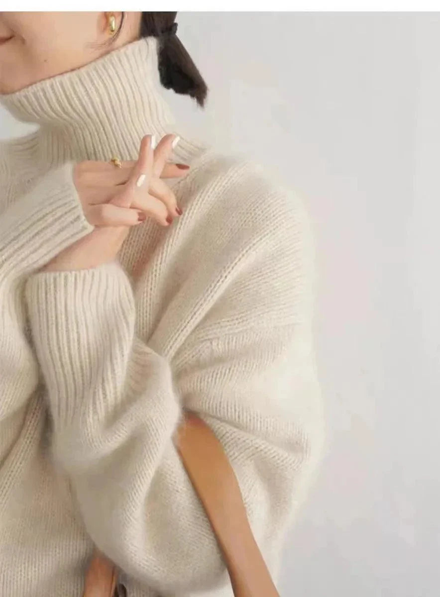 Luxurious 100% cashmere turtleneck sweater for women, featuring a loose fit and elegant design perfect for winter.