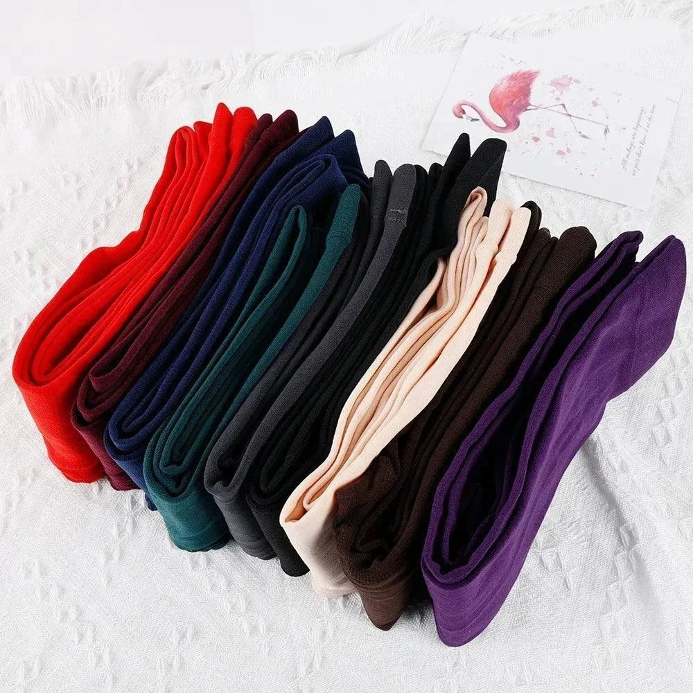 Women’s thermal stockings in assorted colors, fleece-lined for warmth, high-waisted elastic fit, ideal for winter layering.