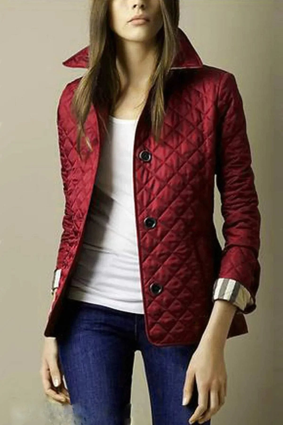 Quilted winter coat for women, single-breasted with turn-down collar, elegant design.