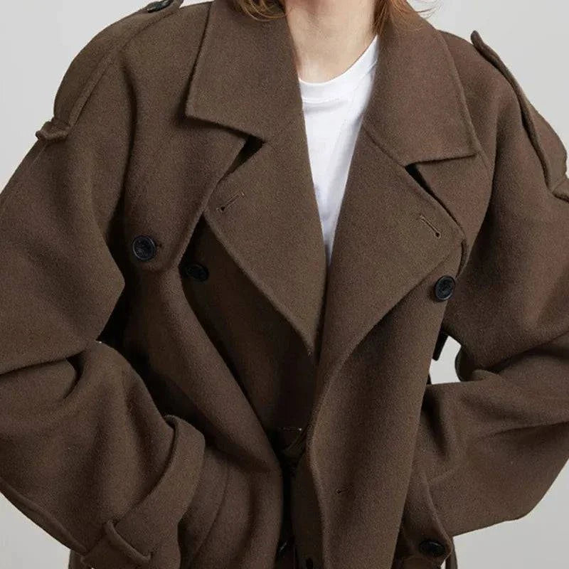 Elegant brown woolen overcoat with double-breasted design and loose lapels, ideal for autumn.