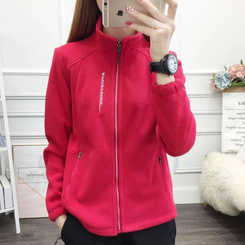 Plus size fleece coat for women in pink, ideal for winter and spring outdoor activities.