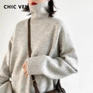 Switch Women&#39;s loose turtleneck pullover knitwear sweater in solid gray, featuring a relaxed fit and oversized collar for warmth and style. 1 image