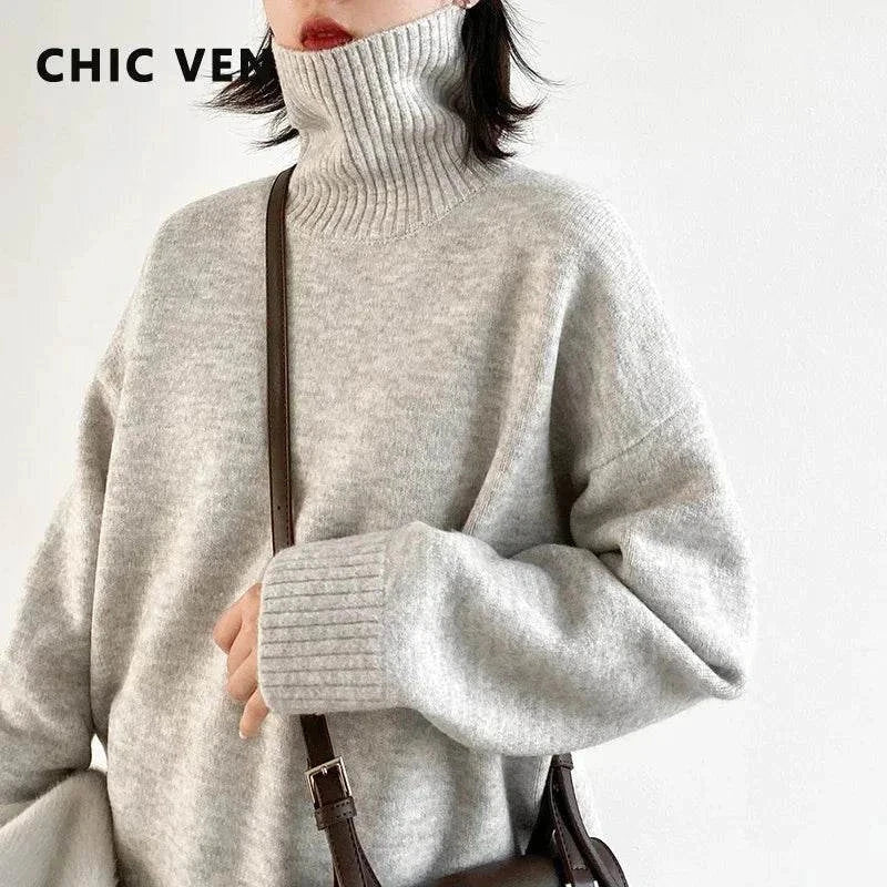 Women's loose turtleneck pullover knitwear sweater in solid gray, featuring a relaxed fit and oversized collar for warmth and style.