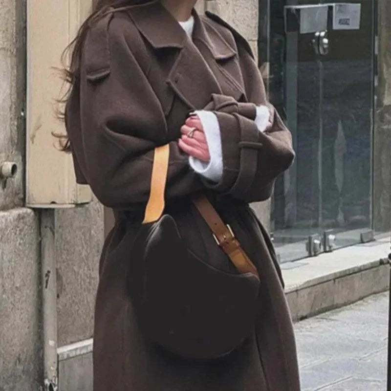 Elegant brown woolen overcoat with double-breasted design and adjustable belt for autumn wear.