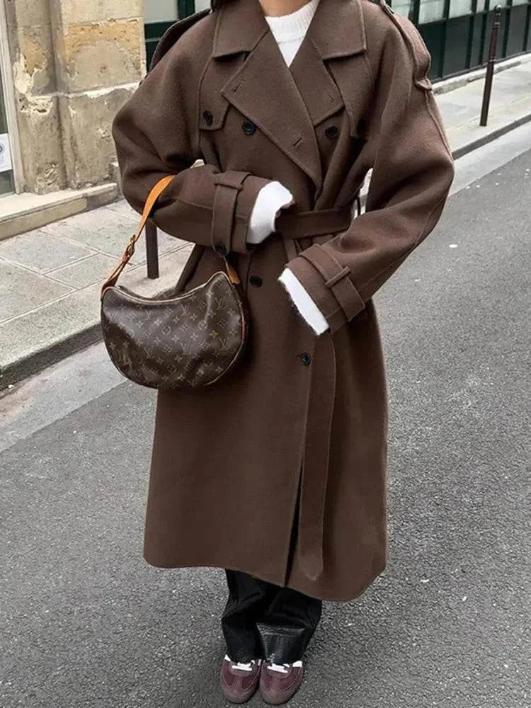 Elegant brown woolen overcoat with double-breasted design and loose lapel.