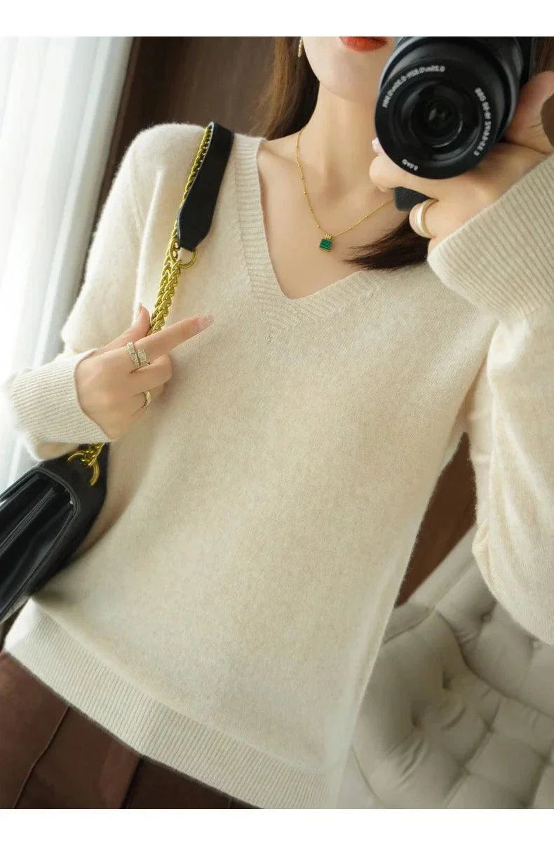 Cashmere women's V-neck pullover sweater with long sleeves, showcasing a casual knitted design.