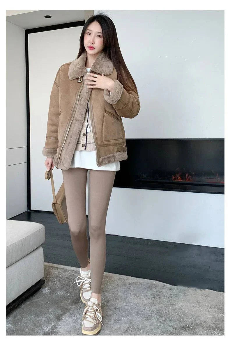 Woman wearing Autumn Thin Rabbit Fleece Shark Leggings with a high waist and elastic fit, styled for a cozy winter look.