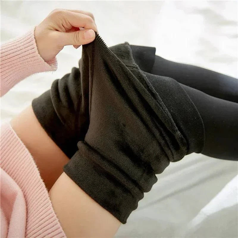 Women’s thermal stockings with fleece lining for warmth, featuring a stretchy high-waisted design.