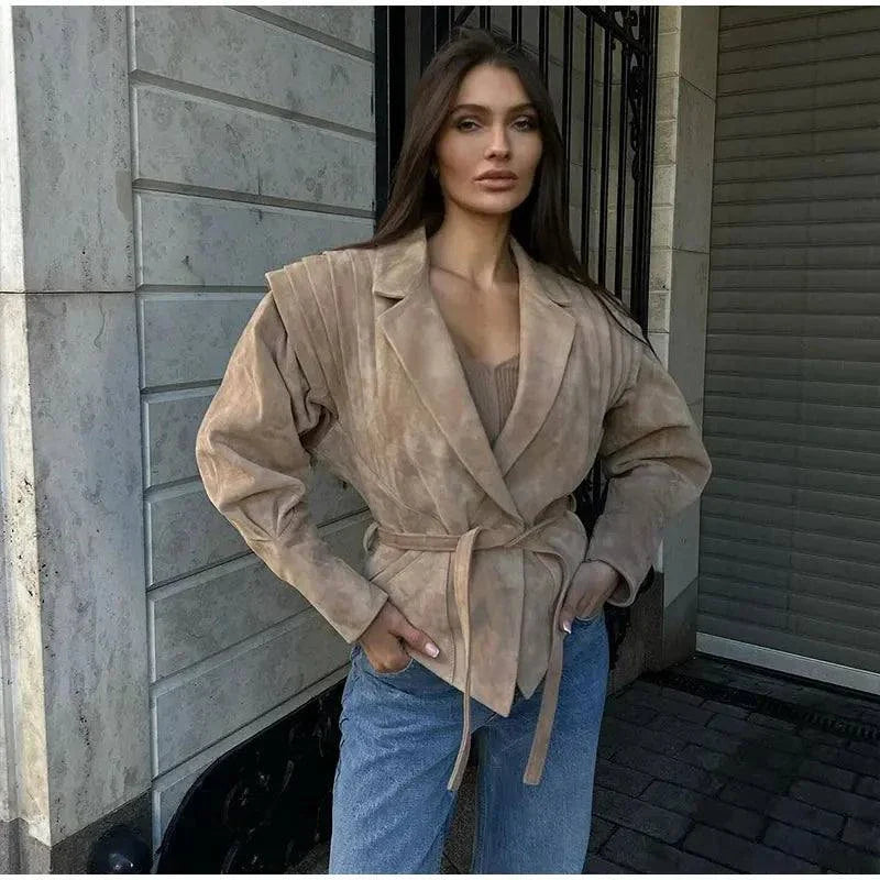 Vintage lapel leather jacket for women with long sleeves, lace-up details, and pockets; chic autumn fashion streetwear.