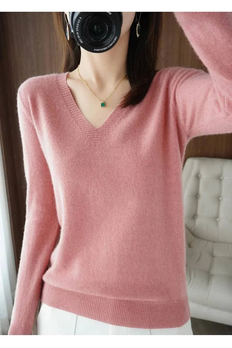 Cashmere women's V-neck pullover sweater with long sleeves in pink.