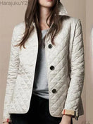 Switch Elegant quilted winter coat for women with single-breasted design and turn-down collar. 1 image