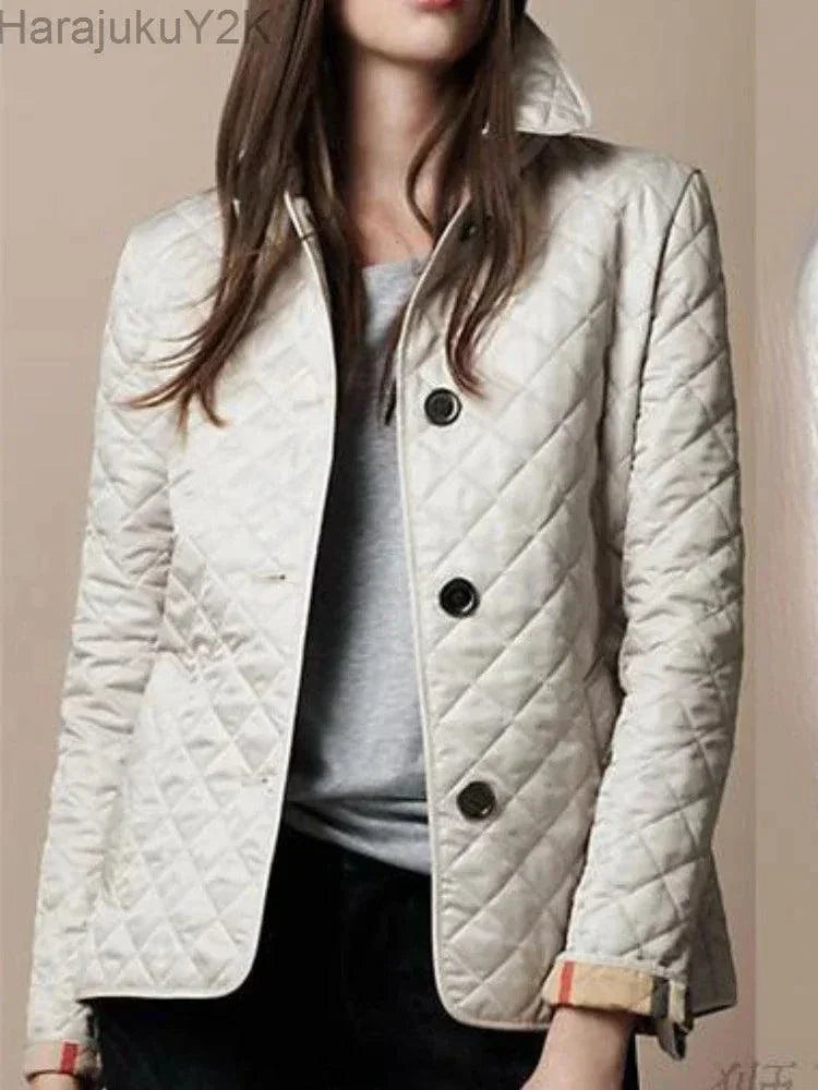 Elegant quilted winter coat for women with single-breasted design and turn-down collar.