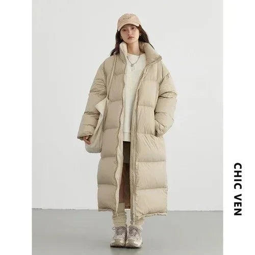 Women’s long down coat, thick warm, casual loose fit, autumn winter 2023.