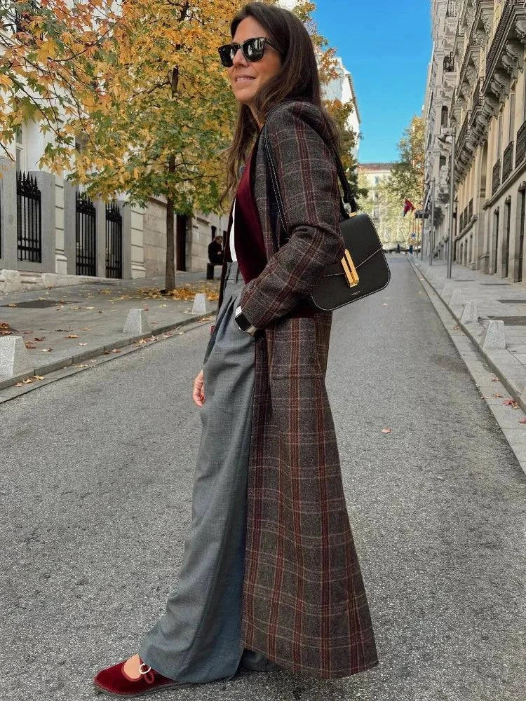 Fashionable woman wearing colorful plaid woolen overcoat with turn-down collar.