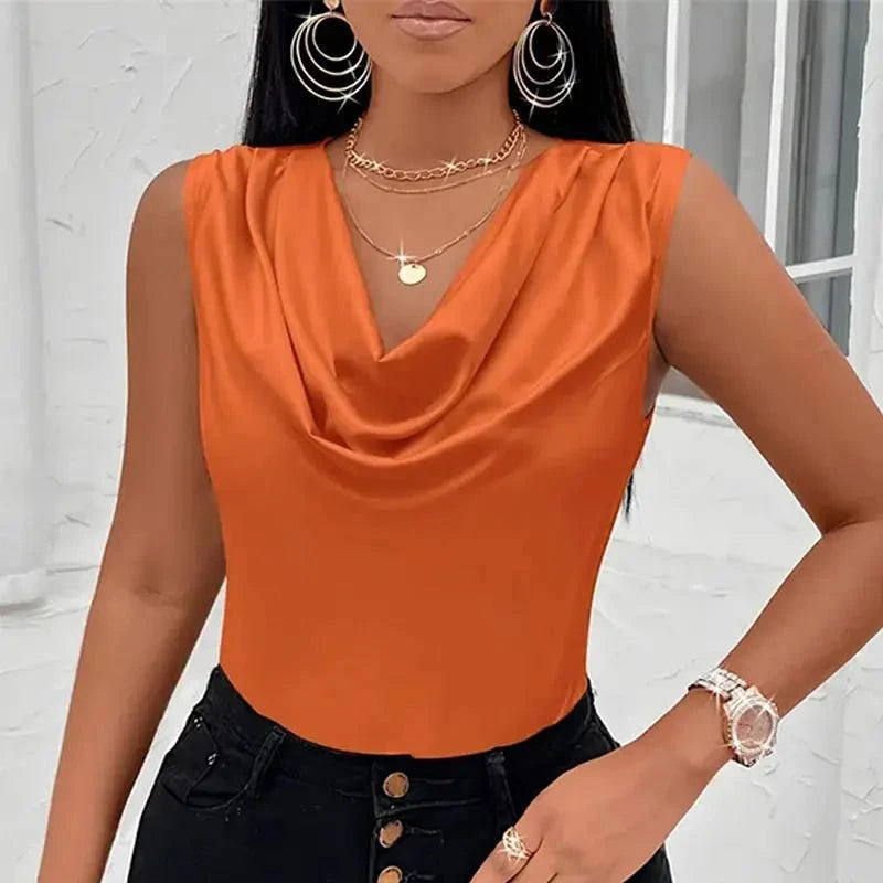 Elegant Satin Cowl Neck Tank Top in solid orange, sleeveless design, paired with black pants.