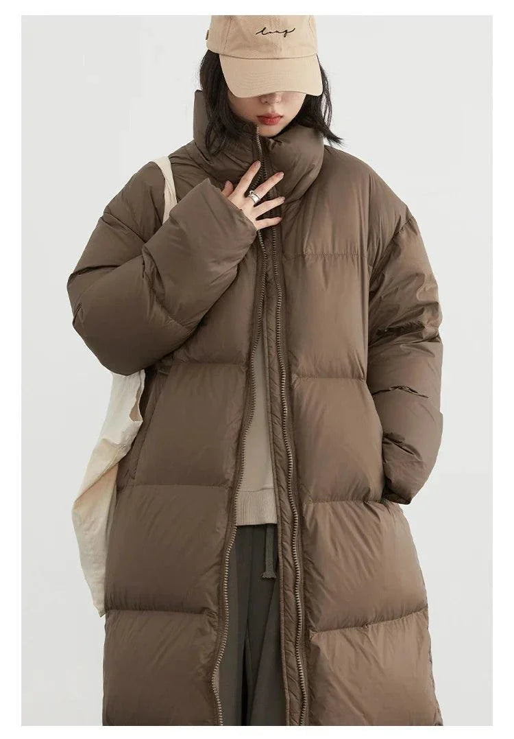 Women’s long down coat, thick and warm, brown, casual fit, autumn winter 2023.