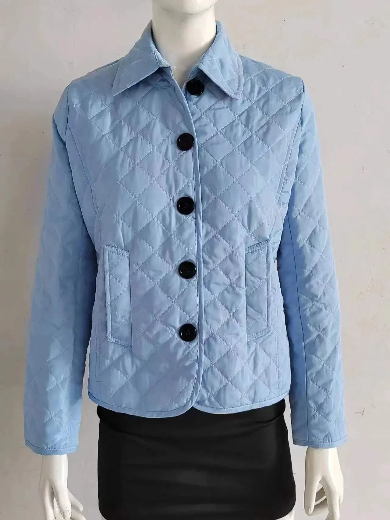 Quilted coat winter jacket for women with turn-down collar and single-breasted design.