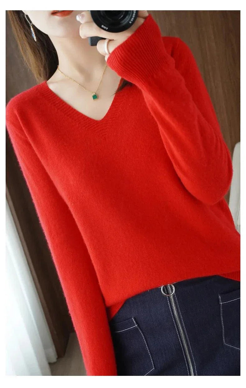 Red cashmere women's V-neck pullover sweater with long sleeves and casual elegance.