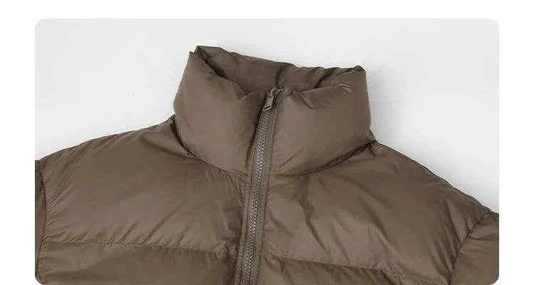 Women's long down coat, solid color, featuring front zipper, thick and warm design for autumn and winter 2023.