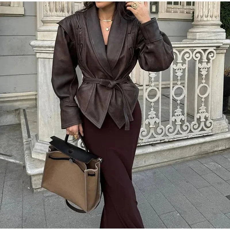 Vintage lapel leather jacket for women with long sleeves, chic design, and functional pockets, perfect for autumn fashion.