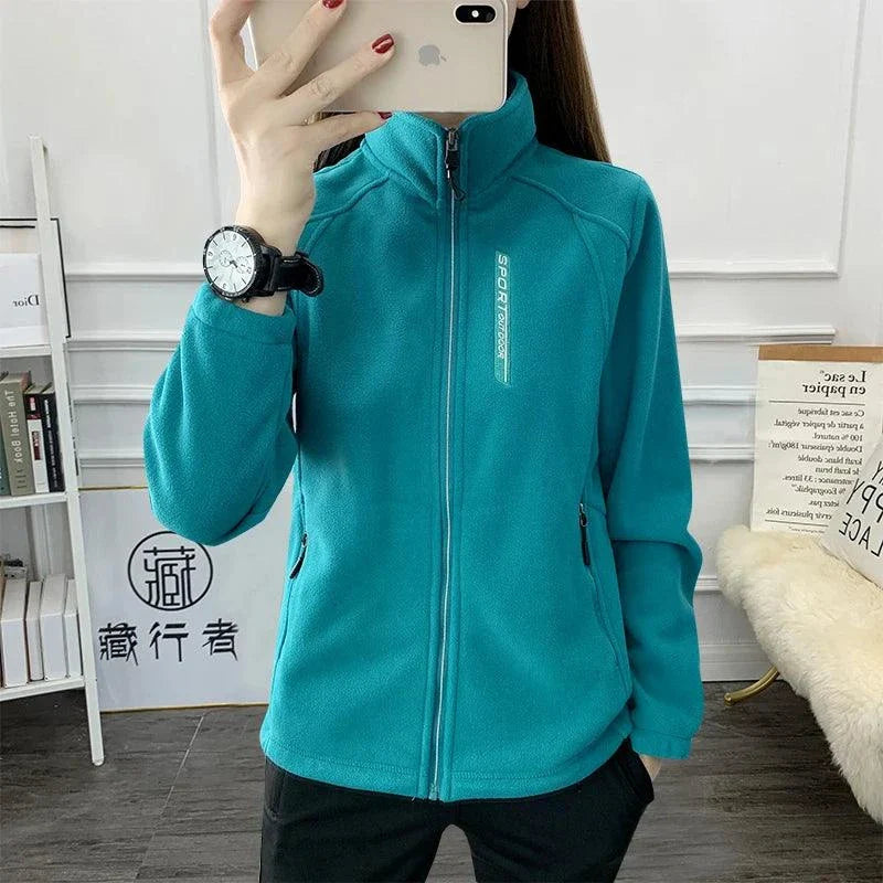 Plus size teal fleece coat for women, warm and stylish for winter and spring outdoor activities.