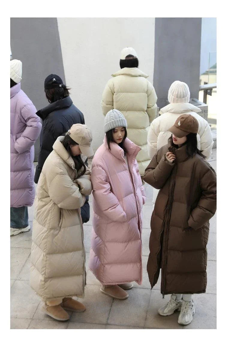 Long down coats for women, showcasing loose casual styles ideal for autumn and winter 2023.