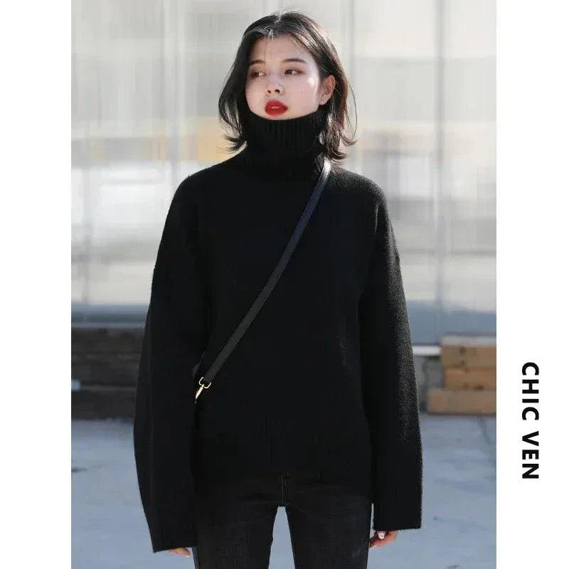 Women's black loose turtleneck sweater, cozy knitwear for autumn and winter.