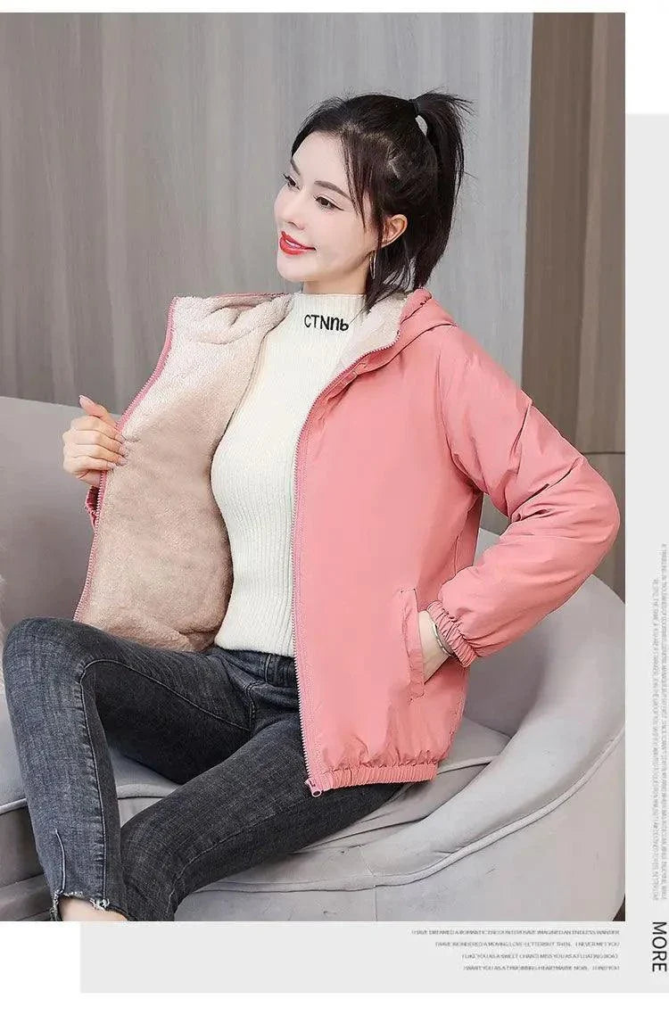 Women's winter fleece hooded jacket, pink, casual outdoor windproof design with plush lining.