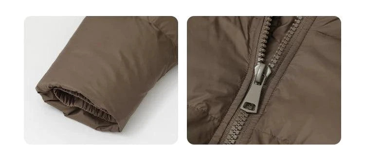 Close-up of a zipper and sleeve detail on a brown women's long down coat, featuring a relaxed fit for autumn/winter 2023.