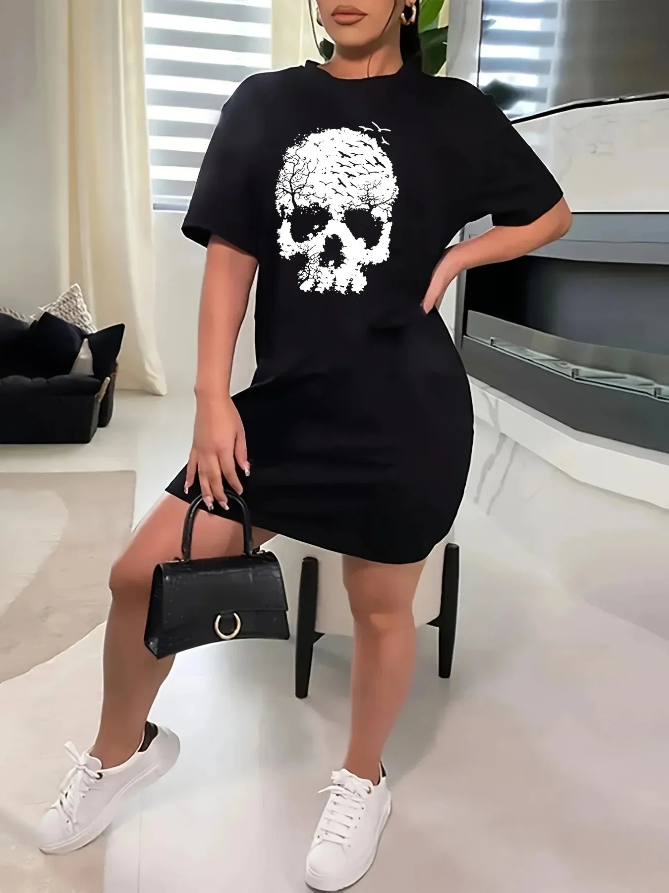 Plus size skull print casual t-shirt dress with short sleeves and round neck.