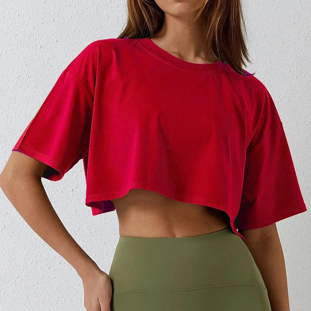 Red cotton crop top for active women, perfect for yoga and workouts.