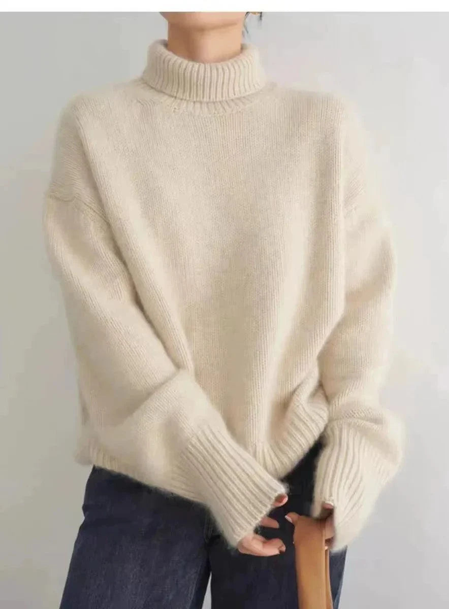 100% Pure Cashmere Women's Loose Turtleneck Sweater in ivory, featuring a relaxed fit for winter warmth.