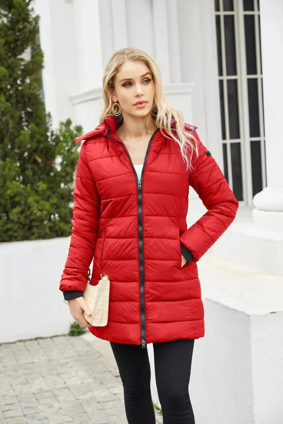 Women's red waterproof parka with detachable hat, long sleeves, and full zipper for autumn and winter.