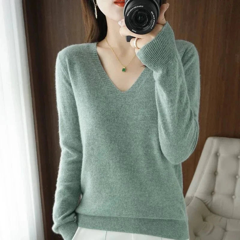 Women's cashmere V-neck pullover sweater with long sleeves and elegant knit design.