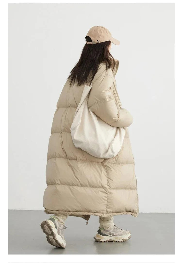 Women's long down coat, thick warm jacket for autumn/winter, beige color, casual loose fit, stylish and cozy outfit.