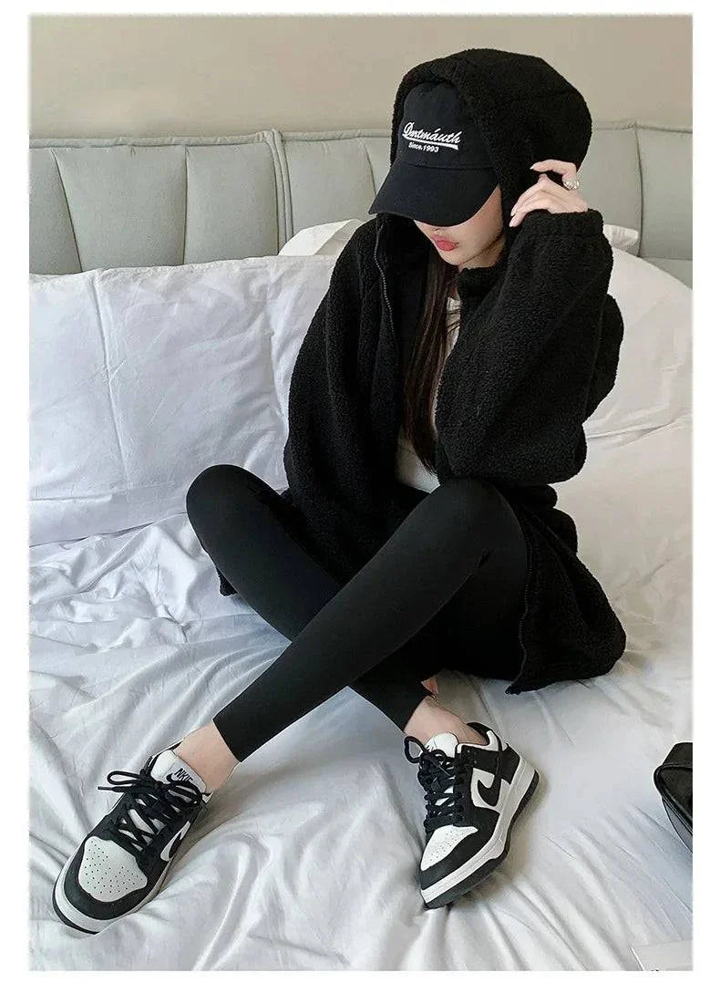 Women wearing Autumn Thin Rabbit Fleece Shark Leggings, showcasing high waist and elastic fit, perfect for winter warmth and style.