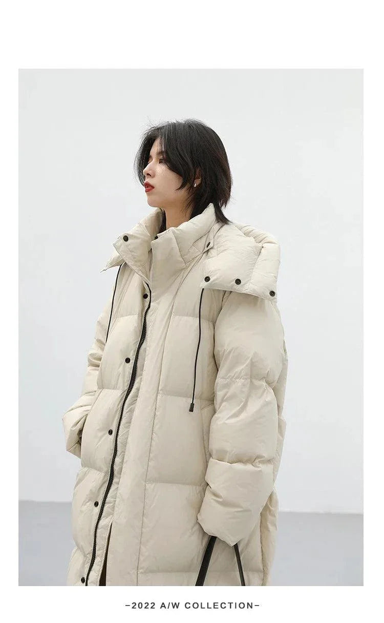 Korean loose hooded long winter jacket for women, thick and warm with detachable hood.