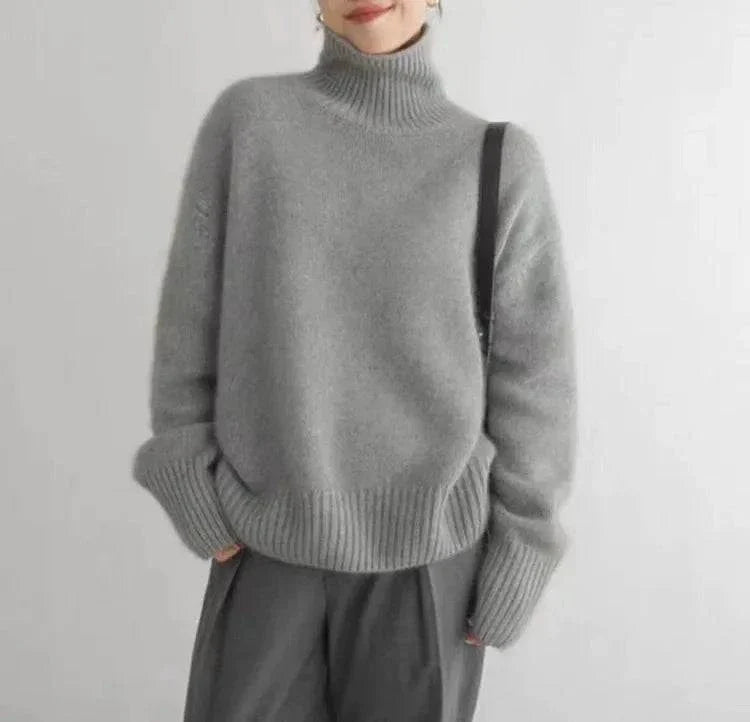 Winter wool cashmere turtleneck sweater for women, loose fit, minimalist style.