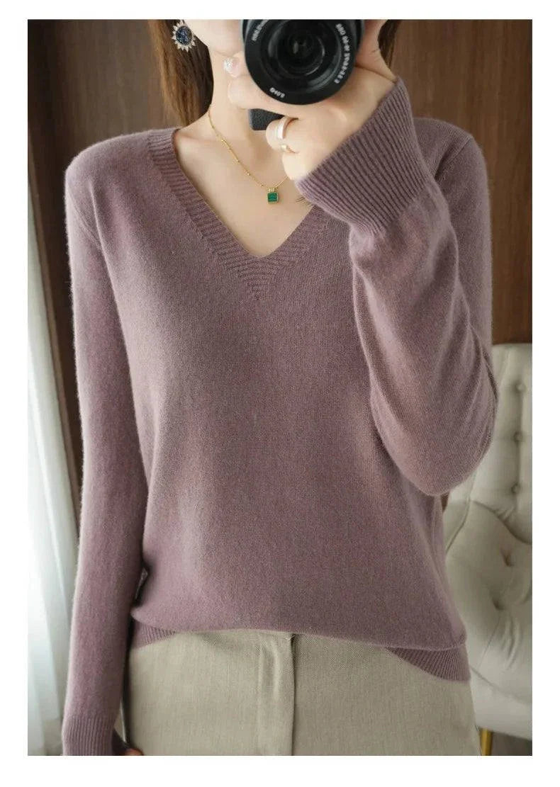 Cashmere women's V-neck pullover sweater with elegant design and long sleeves.