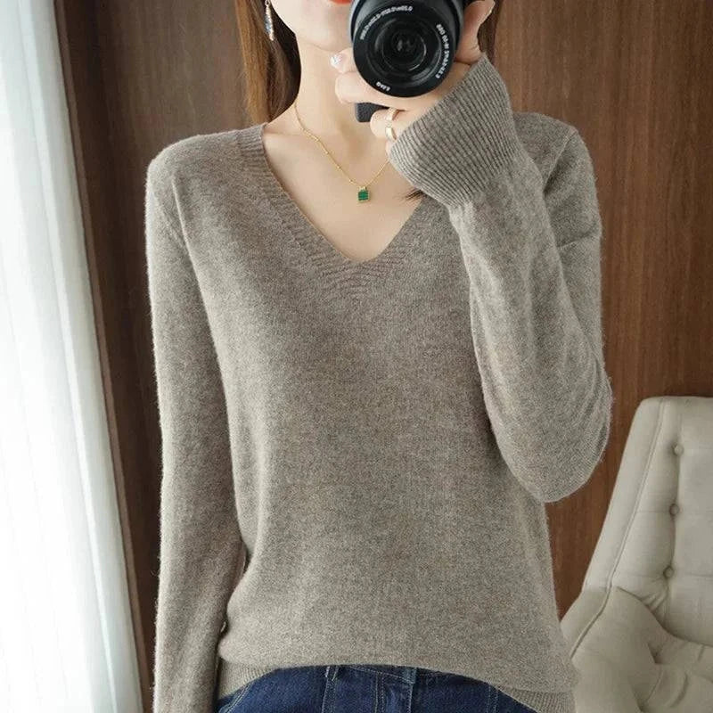 Cashmere V-neck pullover sweater for women with long sleeves, casual elegant design.