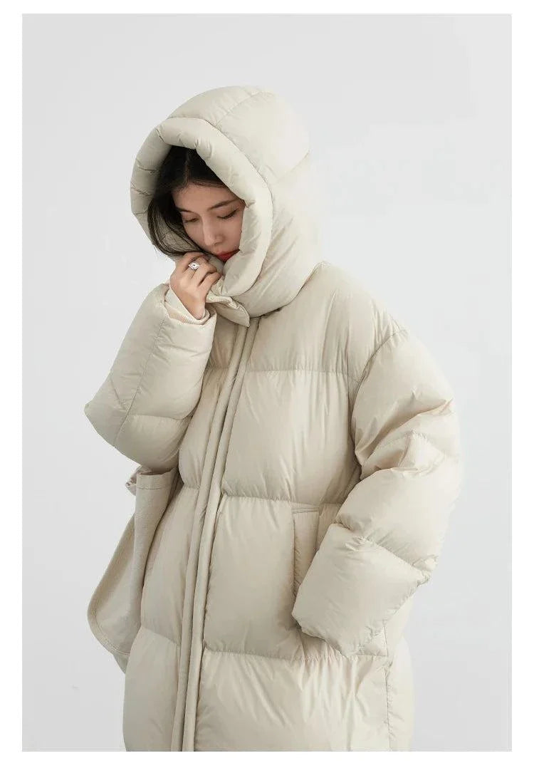 Warm women's long down coat with detachable hood, ideal for autumn and winter 2023.