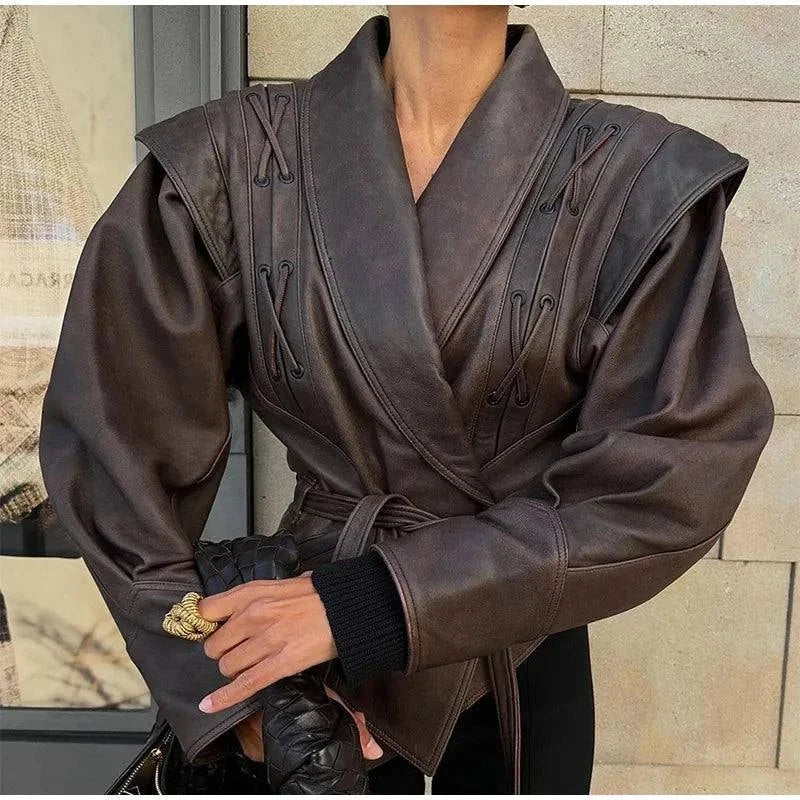 Vintage lapel leather jacket for women with lace-up details, long sleeves, and pockets; chic autumn streetwear.